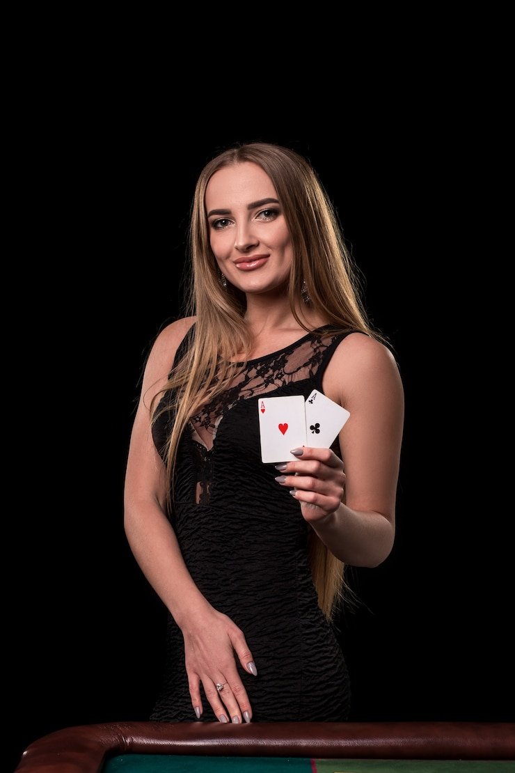 Live dealer at Bikini Paradise studio on bolaresmi, seated at blackjack table with HD camera feed
